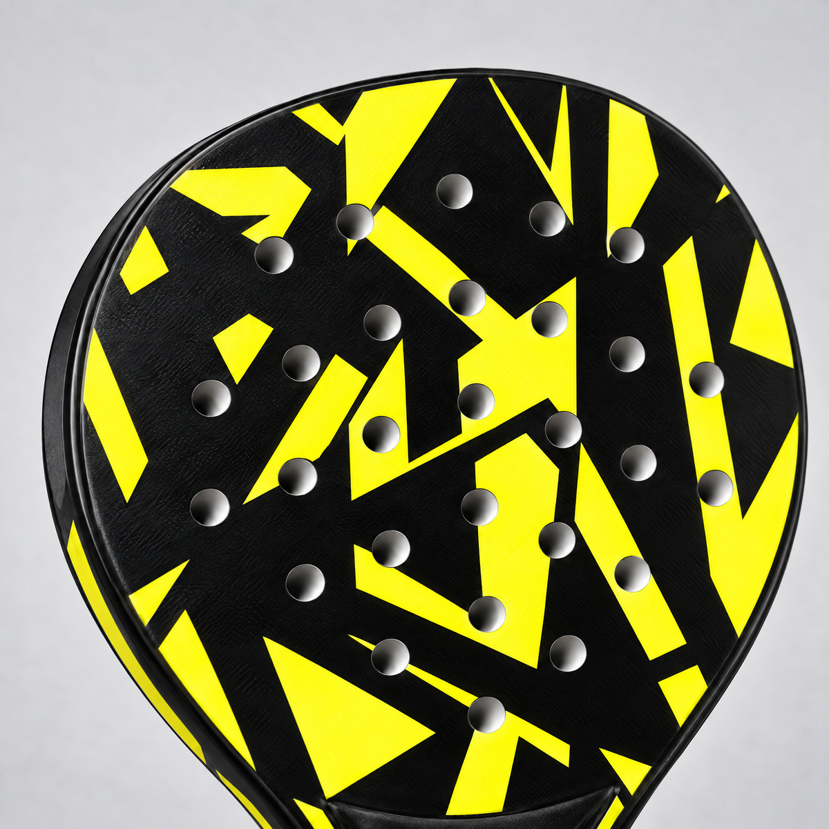 Close-up of the yellow racket face and hole pattern