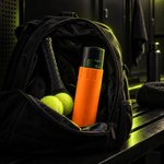Orange pressuriser packed in a padel backpack #Color_Orange
